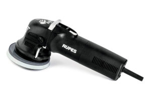 Black Rupes branded electric polisher tool with a white pad.