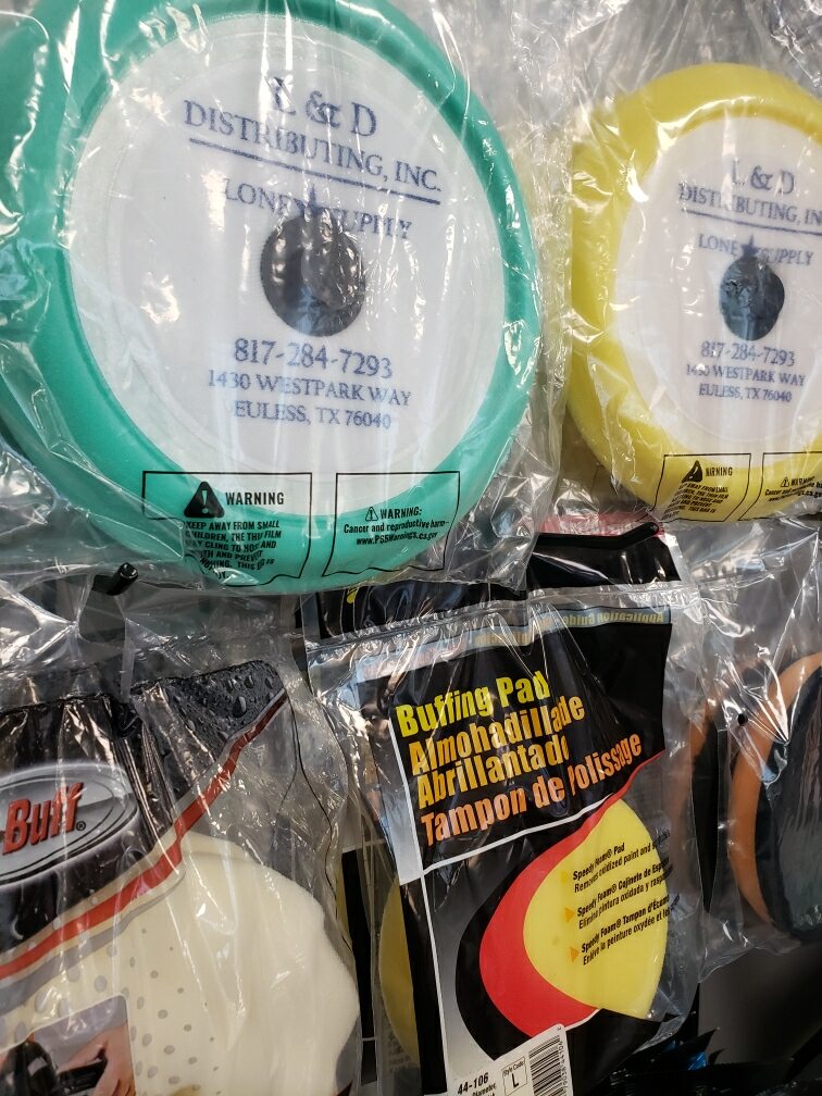 Various guitar strings in colorful packaging displayed in a store.