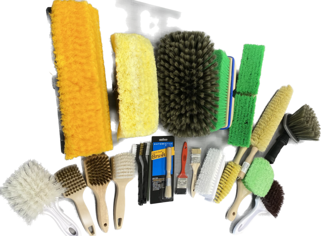 A collection of various brushes and cleaning tools in different sizes and colors.