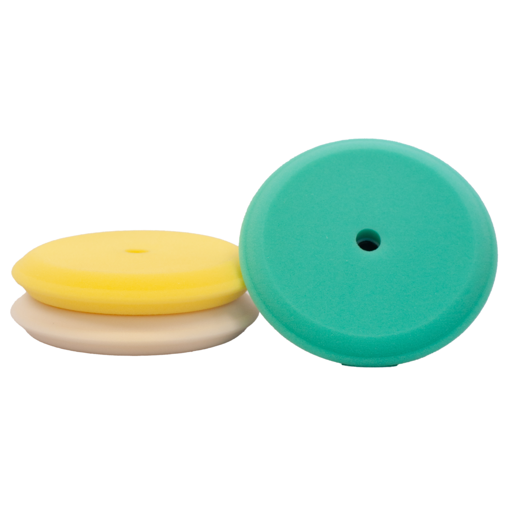 Three circular foam pads in teal, yellow, and beige colors.