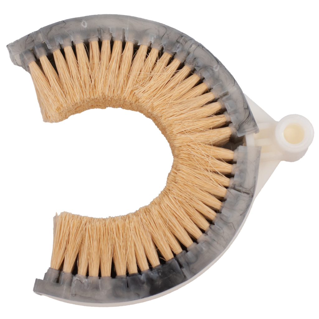 A curved brush with stiff bristles and a plastic handle.