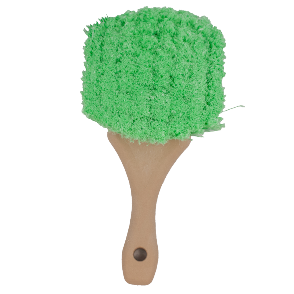 Green bath brush with wooden handle.