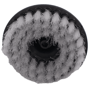Close-up of a round brush head with dense bristles.