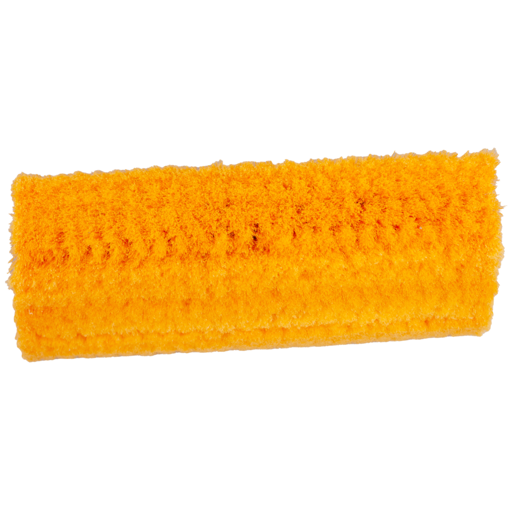 A bright orange cleaning sponge with a textured surface.