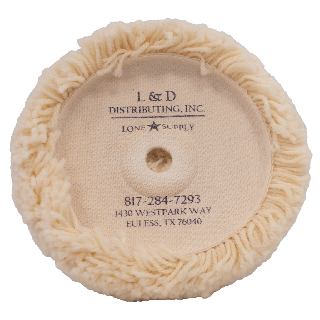 A round, fluffy beige cleaning pad with company branding in the center.