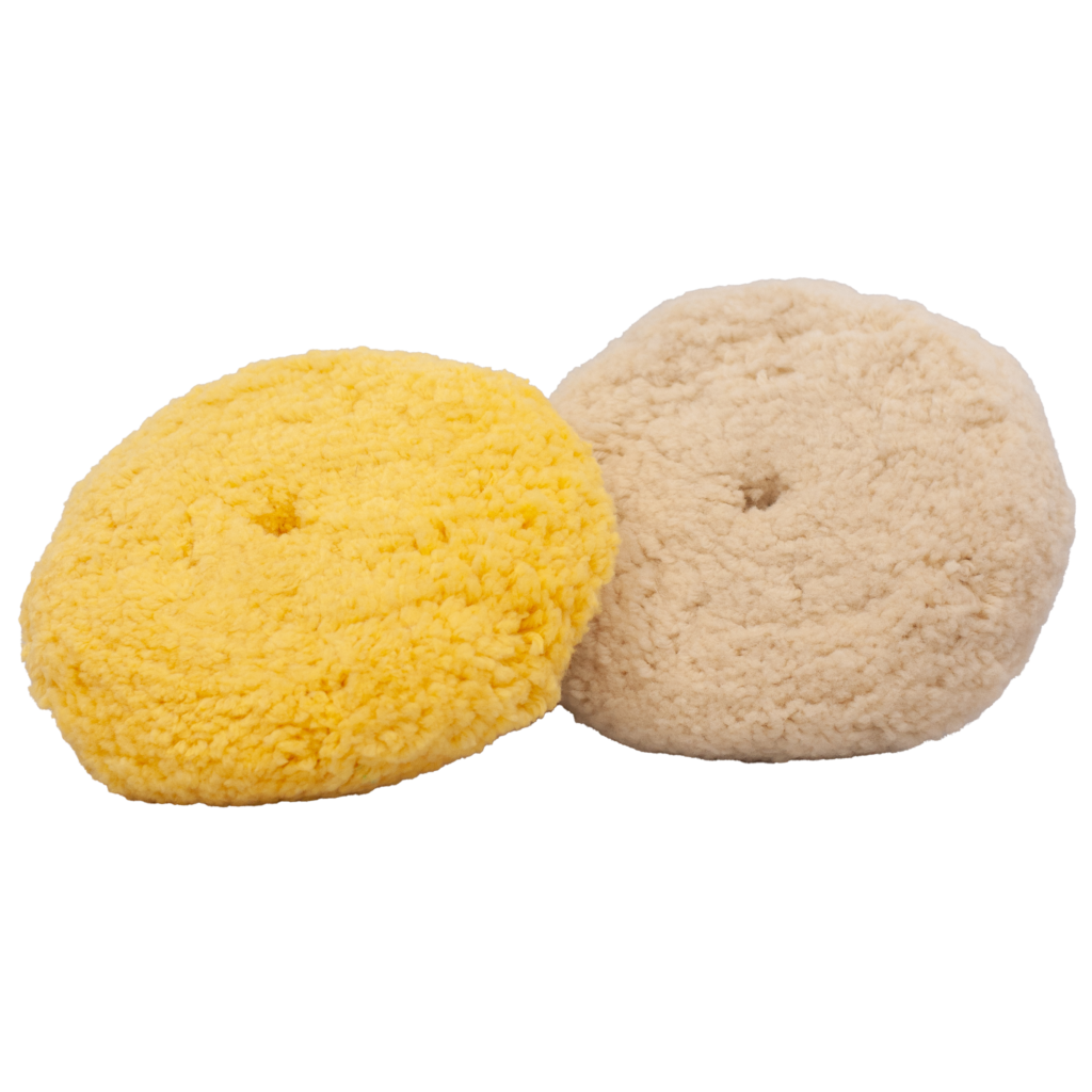 Two round wool buffing pads in yellow and beige.