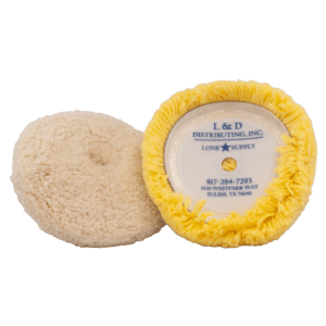Two round buffing pads, one beige and one yellow with label.