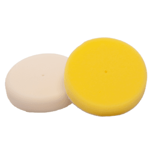Two round polishing pads, one yellow and one white.