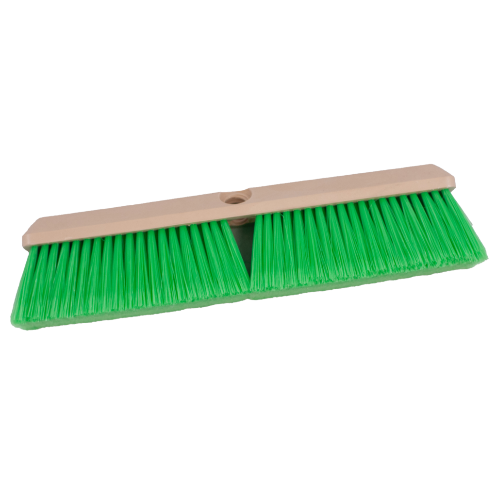 Green broom head with a wooden base, isolated on white.
