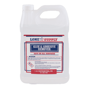 A gallon jug of Lone Star Supply Glue & Adhesive Remover.
