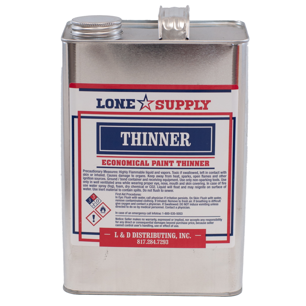 A metal container of Lone Supply paint thinner with hazard labels.