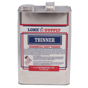A metal container of Lone Supply paint thinner with hazard labels.